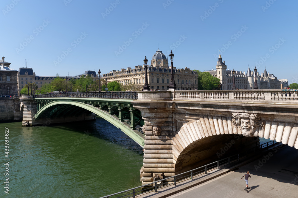 Notre-Dame bridge and Seine river quay in the 4th arrondissement of Paris Notre-Dame bridge and Seine river quay in the 4th arrondissement of Paris
