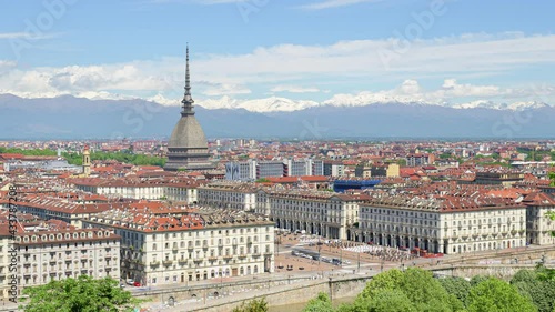 Wallpaper Mural Turin, Italy. Time lapse view of the city with the dome of the Mole building in the middle, the traffic of Piazza Vittorio Veneto and the snowy peaks of the Alps on background. Torontodigital.ca