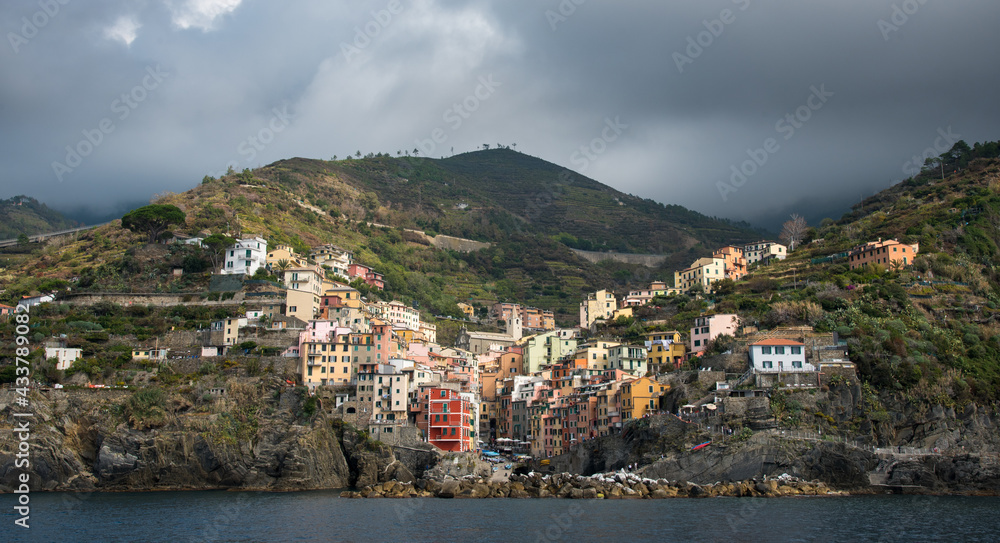 Village of Manarola with colourful houses at the edge of the cliff Riomaggiore,Cinque Terre, Liguria, Italy