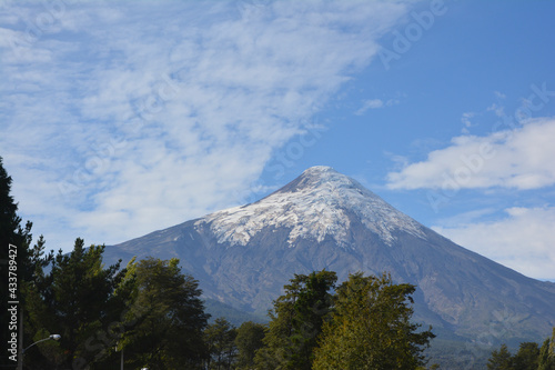 view of the volcano osorno n from in front of the lake. with vegetation