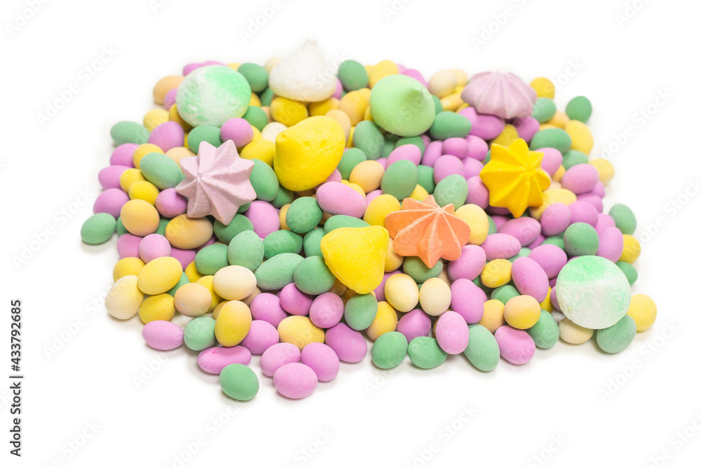 Colorful meringues and glazed peanuts isolated on a white background. Colorful meringues and glazed peanuts isolated on a white background.