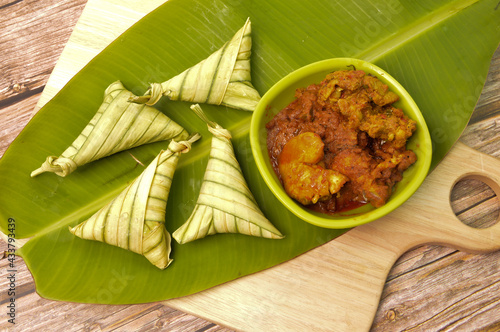 Malay traditional food during Eid Mubarak called as Ketupar rice or Ketupat Palas. Glutinous rice is wrapped with banana leaf, eaten with beef, chicken renang and serunding.