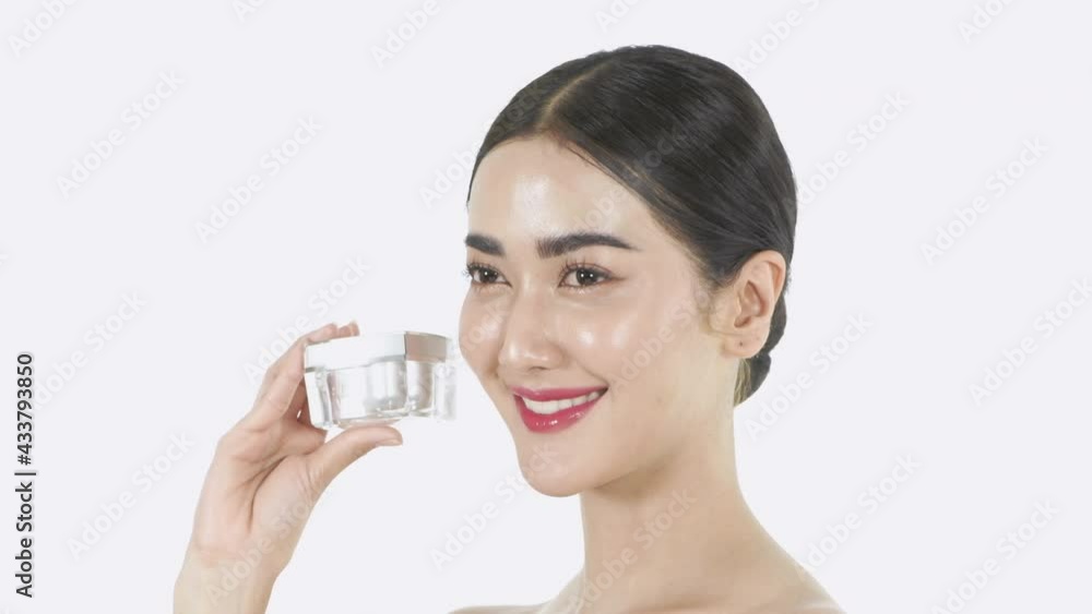 Beauty concept of 4k Resolution. Young woman presenting cream bottles on a white background. Beauty concept of 4k Resolution. Young woman presenting cream bottles on a white background.