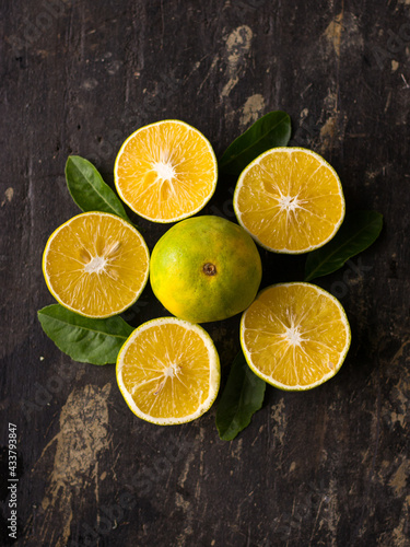 Fototapeta Naklejka Na Ścianę i Meble -  Fresh Mousambi OR Green lemon stock image on dark background.