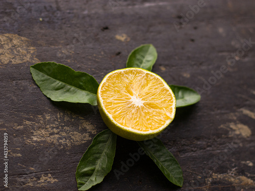 Fresh Mousambi OR Green lemon stock image on dark background. photo
