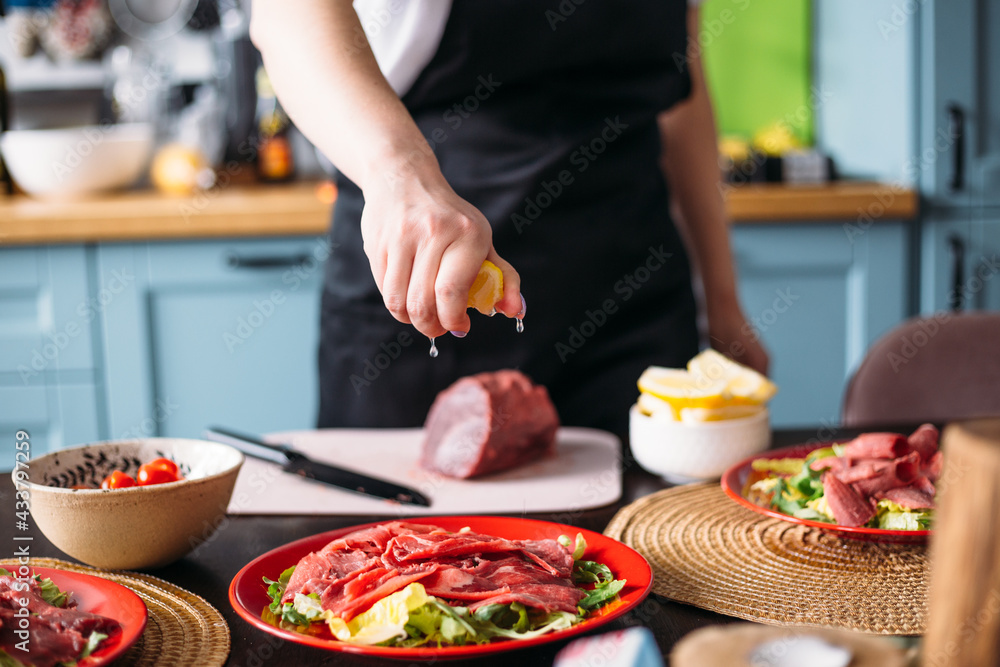 Cooking at home in kitchen Italian carpaccio made from beef Cooking at home in kitchen Italian carpaccio made from beef