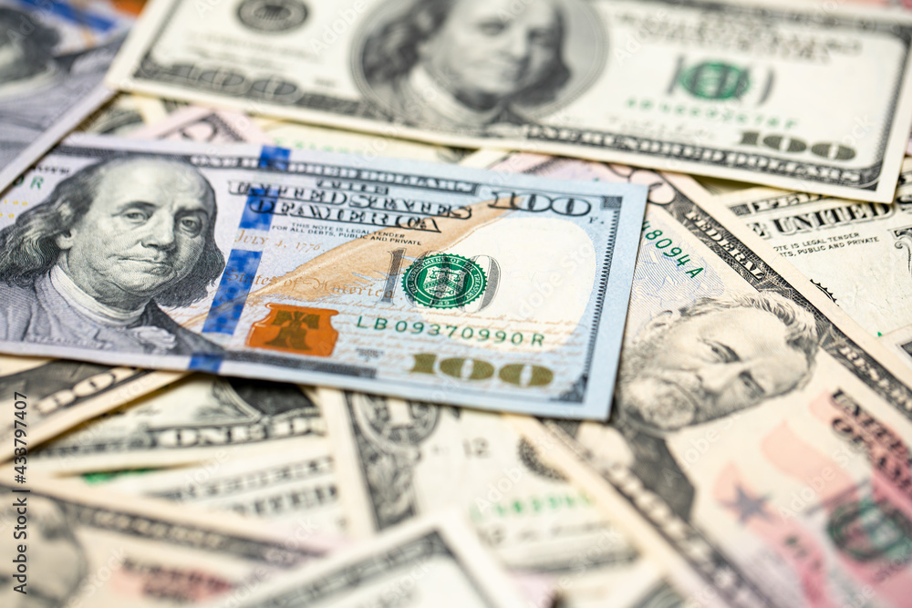 Closeup of one hundred dollar banknotes, new and old paper bills from USA. American cash and money piled up Closeup of one hundred dollar banknotes, new and old paper bills from USA. American cash and money piled up