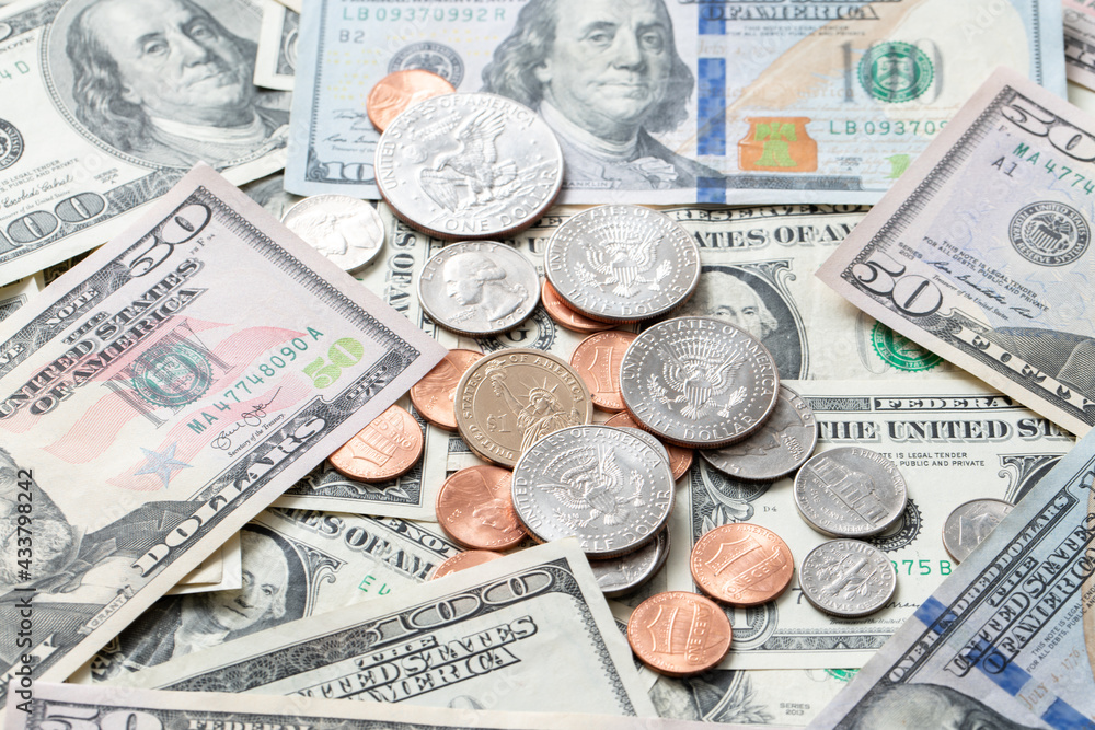 Dollar coins on banknotes from United States of America. US currency. Cash piled up money. Dollar coins on banknotes from United States of America. US currency. Cash piled up money.