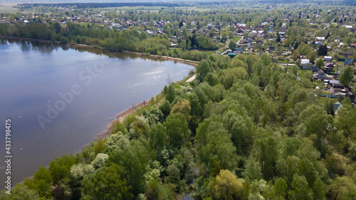 Panoramic view of the countryside and the lake from a bird's eye view. Drone photos, aerial photography.