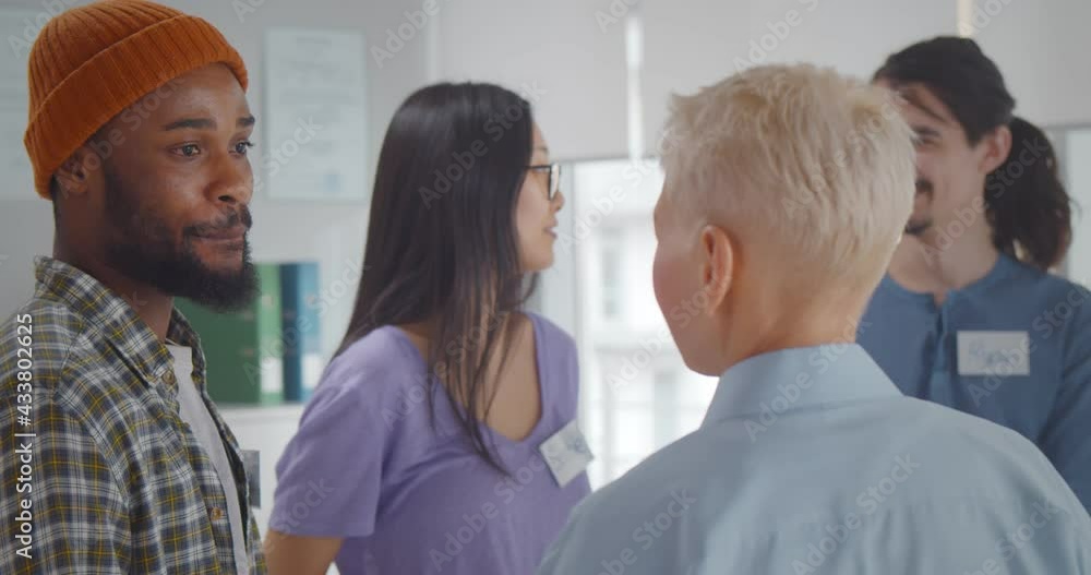 Diverse people attending support group meeting for mental health or dependency issues Diverse people attending support group meeting for mental health or dependency issues