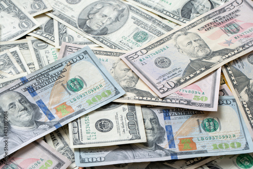 Dollar Banknotes as Background, distributed USD. banknotes from one to one hundred Dollar Bills. Cash piled up