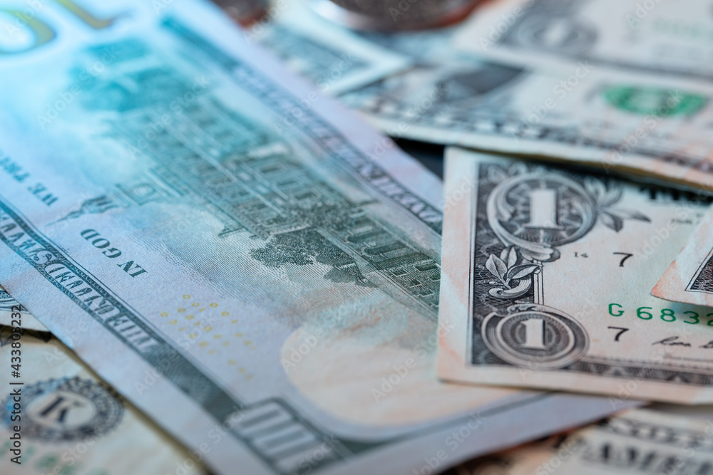 One Hundred Dollar Banknote next to one USD Bills. Economy concept of the United States of America. Piled up Federal Reserve Banknotes One Hundred Dollar Banknote next to one USD Bills. Economy concept of the United States of America. Piled up Federal Reserve Banknotes