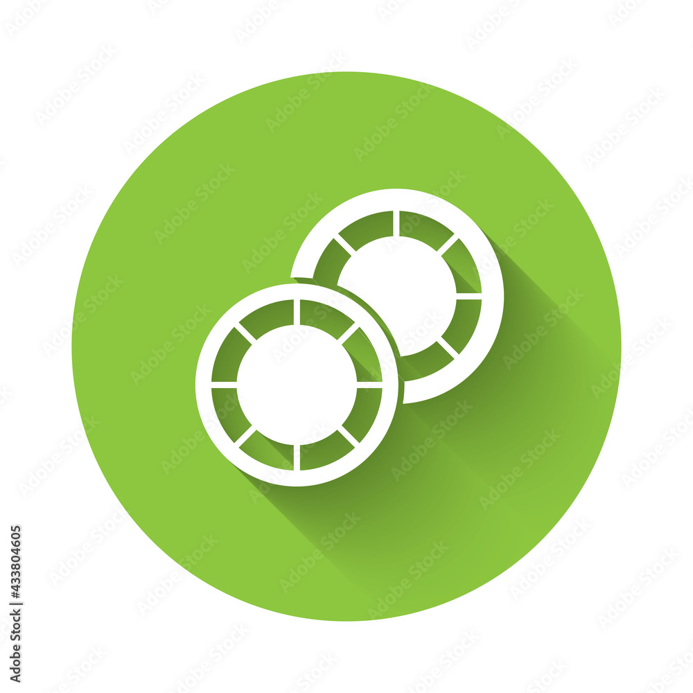 White Casino chips icon isolated with long shadow. Casino gambling. Green circle button. Vector White Casino chips icon isolated with long shadow. Casino gambling. Green circle button. Vector