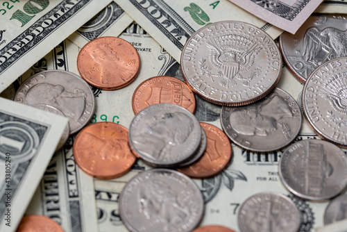US dollar coins and banknotes. Pennies to twenty dollar bills. Money in economy, buying for goods and services