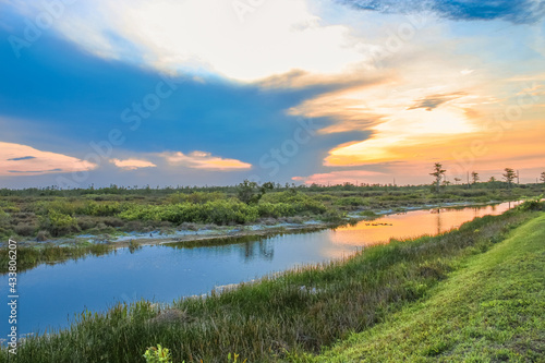 sunset in the swamp refecting in the river