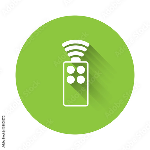 White Remote control for the camera icon isolated with long shadow. An auxiliary device that allows you to work with a camera from a distance. Green circle button. Vector