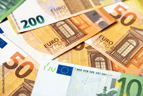 Euro banknotes as background, fifty, one hundred and two hundred euro bills, paper money. European monetary union currency