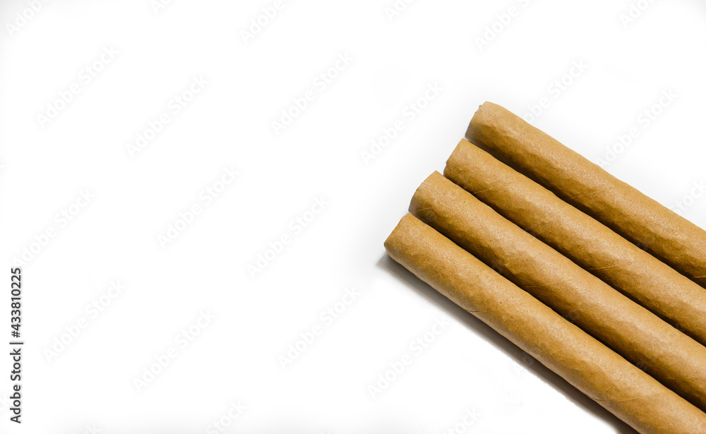 Cigars on a white background, soft focus image. Cigars on a white background, soft focus image.