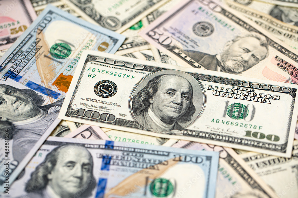 US Dollar banknotes spread out. Pattern of Dollar cash and bills. Paper money from USA. 100 One hundred Dollar bills with 50, fifty USD paper money US Dollar banknotes spread out. Pattern of Dollar cash and bills. Paper money from USA. 100 One hundred Dollar bills with 50, fifty USD paper money
