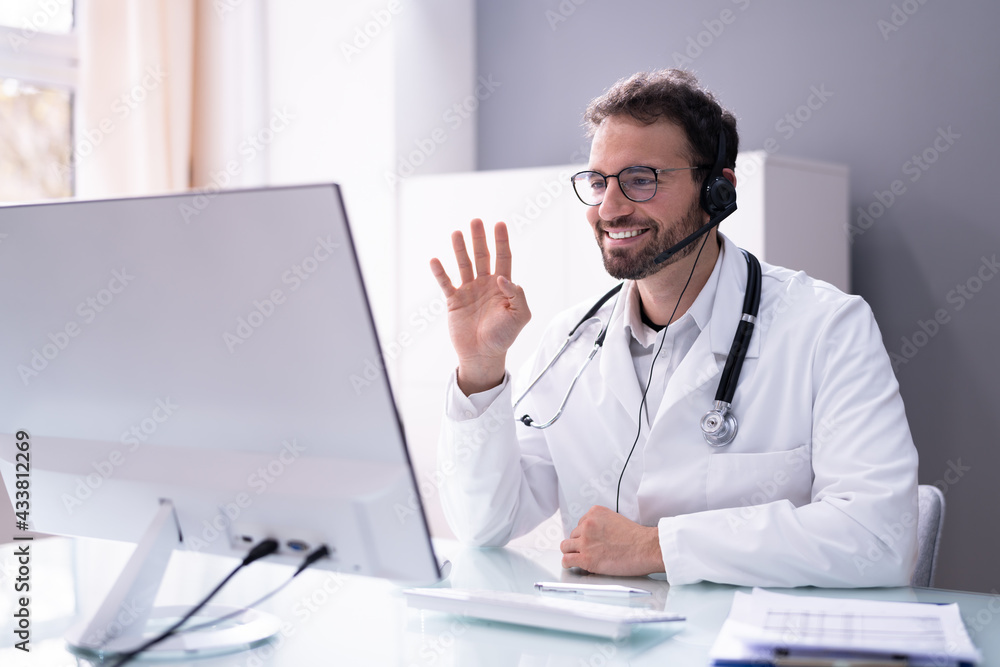 Doctor Having Video Conference On Computer Doctor Having Video Conference On Computer