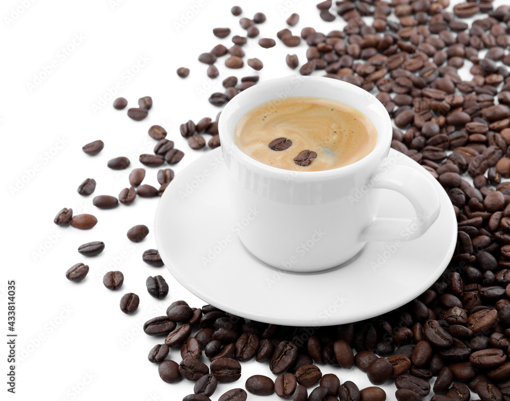 Cup with aromatic coffee and pile of beans on white background Cup with aromatic coffee and pile of beans on white background