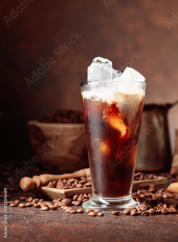 Ice coffee with cream in frozen glass.