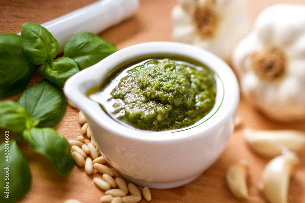 Pestle and ingredients for pesto sauce. High quality photo.