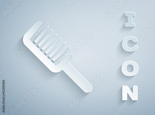 Paper cut Hairbrush icon isolated on grey background. Comb hair sign. Barber symbol. Paper art style. Vector