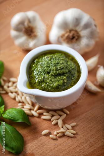 Pestle and ingredients for pesto sauce. High quality photo.