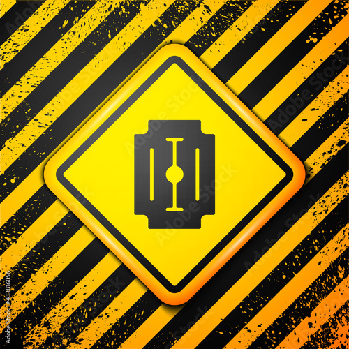 Black Blade razor icon isolated on yellow background. Warning sign. Vector