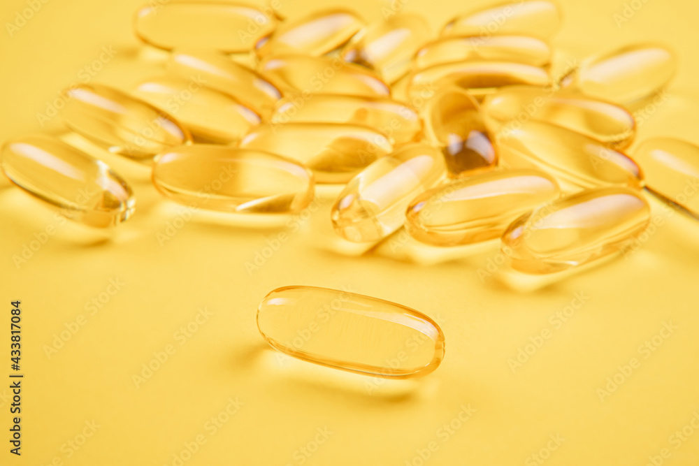Omega 3 capsules.Vitamin drop pill capsule. Shining golden essence droplet.
Omega 3 capsules.Vitamin drop pill capsule. Shining golden essence droplet.