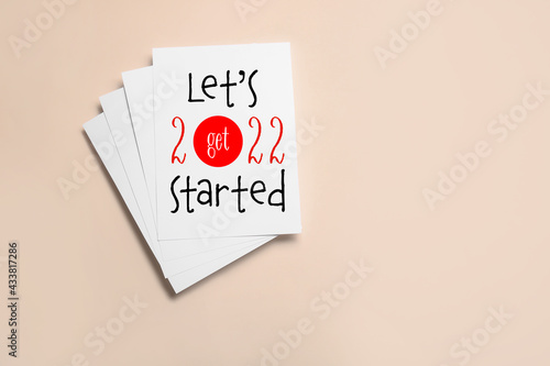 Paper sheets with text LET'...