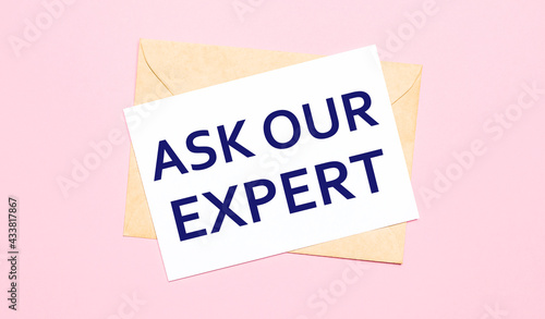 On a light pink background - a craft envelope. It has a white sheet of paper that says ASK OUR EXPERT.
