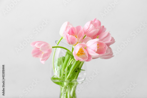 Fototapeta Naklejka Na Ścianę i Meble -  Vase with beautiful tulip flowers on light background