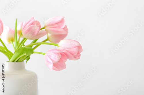 Fototapeta Naklejka Na Ścianę i Meble -  Vase with beautiful tulip flowers on light background