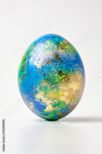 Easter eggs. Easter background. Easter. Copy cpase egg isolated on a white background painted like planet earth, a workpiece for the designer. photo