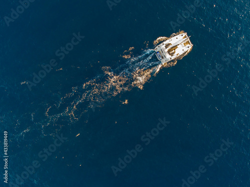 Top down view of a katamarán at Cape Sounio sea in Greece