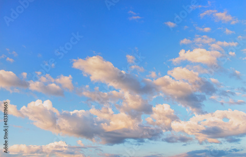 Blue sky and white clouds floated in the sky on a clear day with warm sunshine © olmax1975