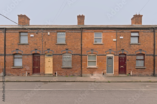 Photography Street with typical Dublin factory worker`s masonry row houses from early industrial era