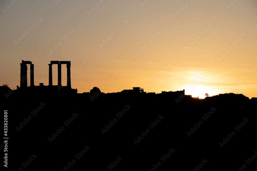 Sunset at Sounion Cape with the silhouette of Poseidon Temple