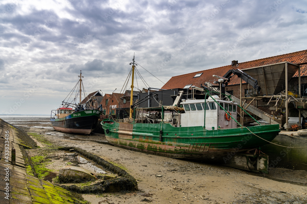 fishing boats in the port of Yerseke at low tide fishing boats in the port of Yerseke at low tide