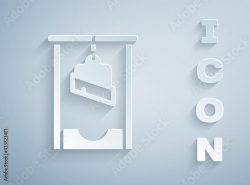 Paper cut Guillotine medieval execution icon isolated on grey background. Paper art style. Vector