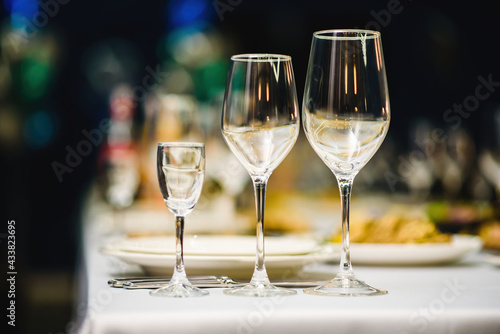 Serving on the table, crystal glasses for wine. Shallow depth of field.