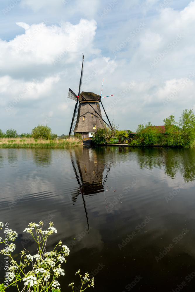 vertical view of a historic 18-century windmill at Kinderdijk in South Holland