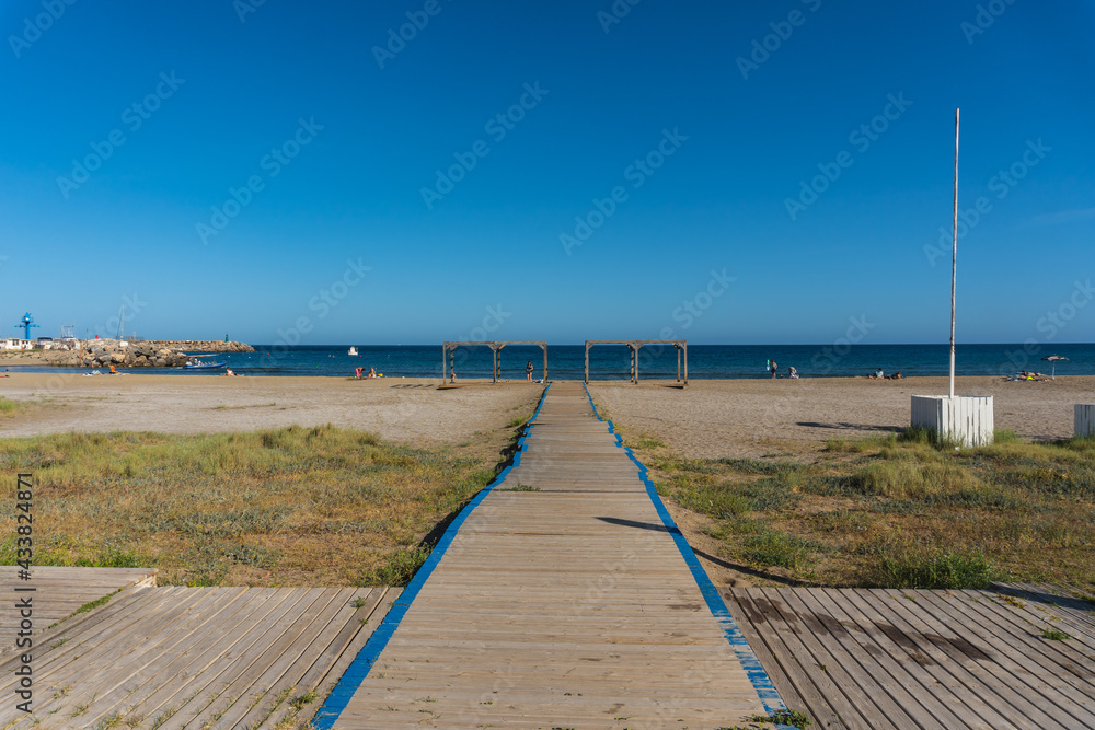 Wooden walkway to San Jose beach in the town of Nijar, Almería. Andalusian coast in Cabo de Gata. Spain