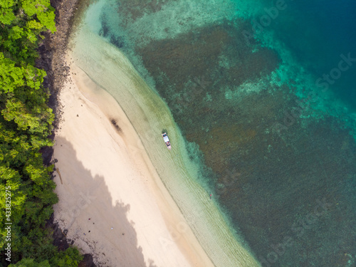 Aerial view of the beach washed by blue ocean water in Indonesia photo