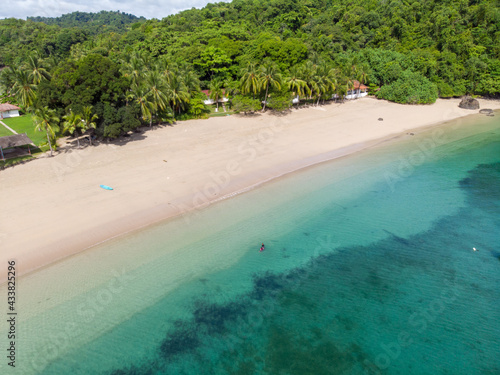 Aerial view of the beach washed by blue ocean water in Indonesia photo