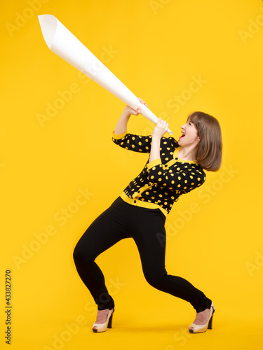 Woman is holding a loudspea...