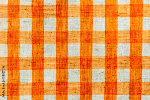 Wallpaper Mural Tablecloth with orange and white stripes which when crossed form squares as a background, texture, pattern. Torontodigital.ca