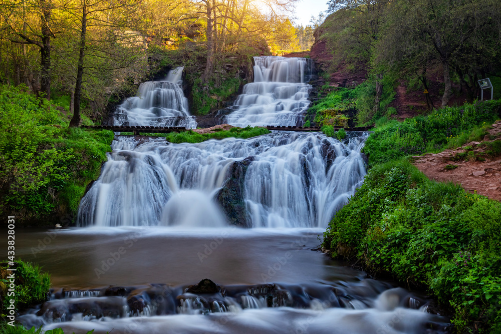 Beautiful waterfall in the canyon in spring. Dzhurinsky waterfall Beautiful waterfall in the canyon in spring. Dzhurinsky waterfall